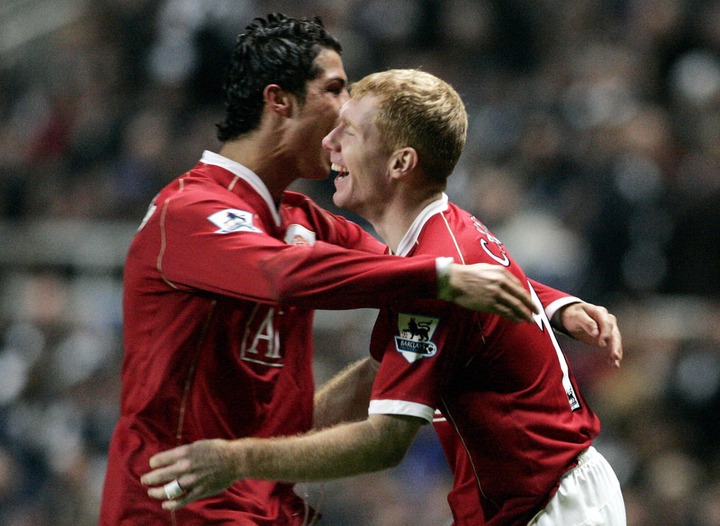 Manchester United's Paul Scholes (R) celebrates his goal with Cristiano Ronaldo during their English Premiership footall match at St James' Park, N...