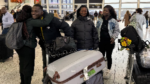 Ghanaian content creator ZionFelix and his family at the airport