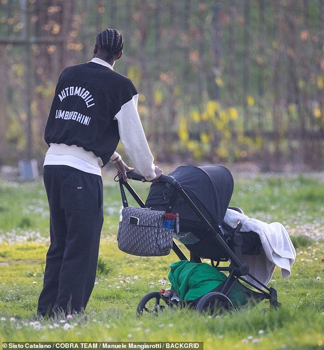 Tammy - who is on loan from AS Roma - gently pushed the baby stroller carrying little Amari, two