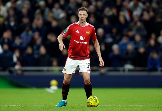 Jonny Evans in possession of the ball for Manchester United against Tottenham Hotspur back in December.