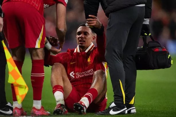 LIVERPOOL, ENGLAND - MARCH 11: Trent Alexander-Arnold of Liverpool is assisted by medical staff after sustaining an injury during the UEFA Champions League 2024/25 Round of 16 Second Leg match between Liverpool FC and Paris Saint-Germain at Anfield on March 11, 2025 in Liverpool, England. (Photo by Joe Prior/Visionhaus via Getty Images)