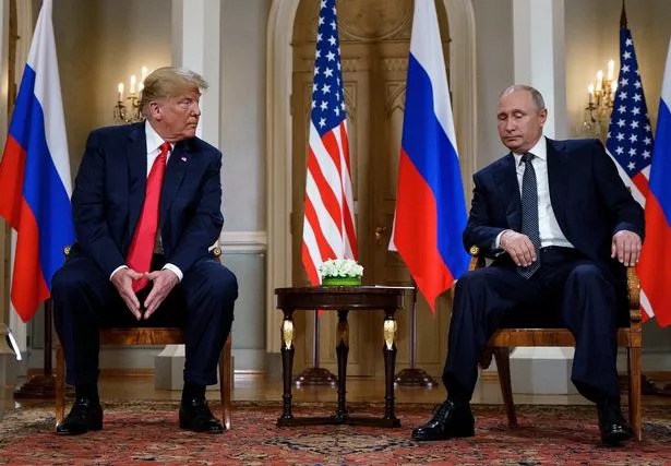 Russian President Vladimir Putin (R) and US President Donald Trump are pictured before a meeting 