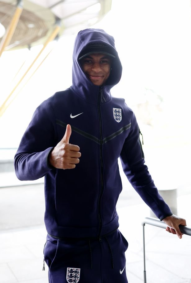 Marcus Rashford offers a thumbs up as he arrives at St George's Park