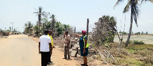 Christina Jatoe-Kaleo assesssing an area affected by the tidal waves