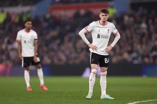 Conor Bradley of Liverpool looks dejected during the Premier League match between Aston Villa FC and Liverpool FC at Villa Park on February 19, 2025 in Birmingham, England.