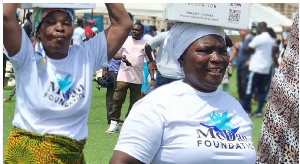 Some of the widows carrying the items they received