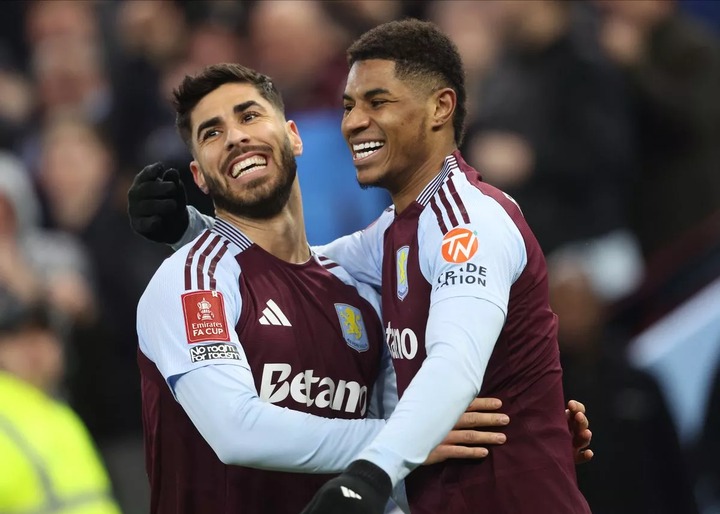 Marco Asensio celebrating with Marcus Rashford