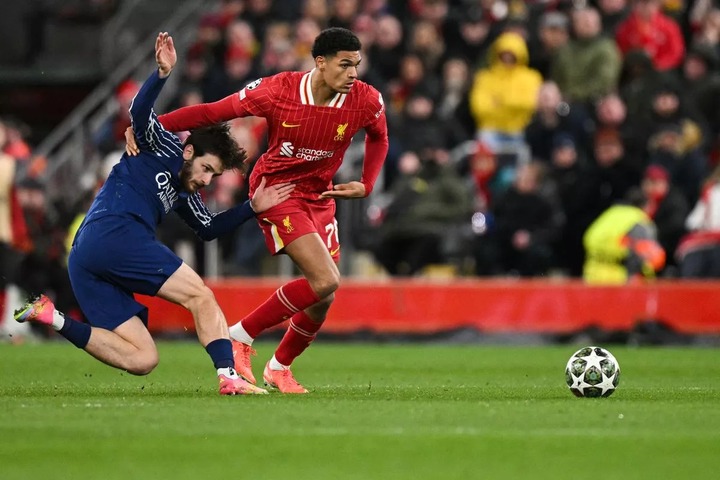 Paris Saint-Germain's Georgian forward #07 Khvicha Kvaratskhelia (L) fights for the ball with Liverpool's English defender #78 Jarell Quansah during the last 16 second leg UEFA Champions League football match between Liverpool and Paris Saint-Germain (PSG) at Anfield in Liverpool, north west England on March 11, 2025. (Photo by Oli SCARFF / AFP) (Photo by OLI SCARFF/AFP via Getty Images)